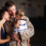 Capt. Lucas Frokjer, officer in charge of the flightline for Marine Heavy Helicopter Squadron 463, reunites with his family after returning from a seven-month deployment with HMH-463. The squadron arrived at Hangar 105 Sept. 17 and were welcomed home by a large crowd of family and friends. The squadron was replaced by HMH-363 who deployed to Afghanistan in August in support of Operation Enduring Freedom.